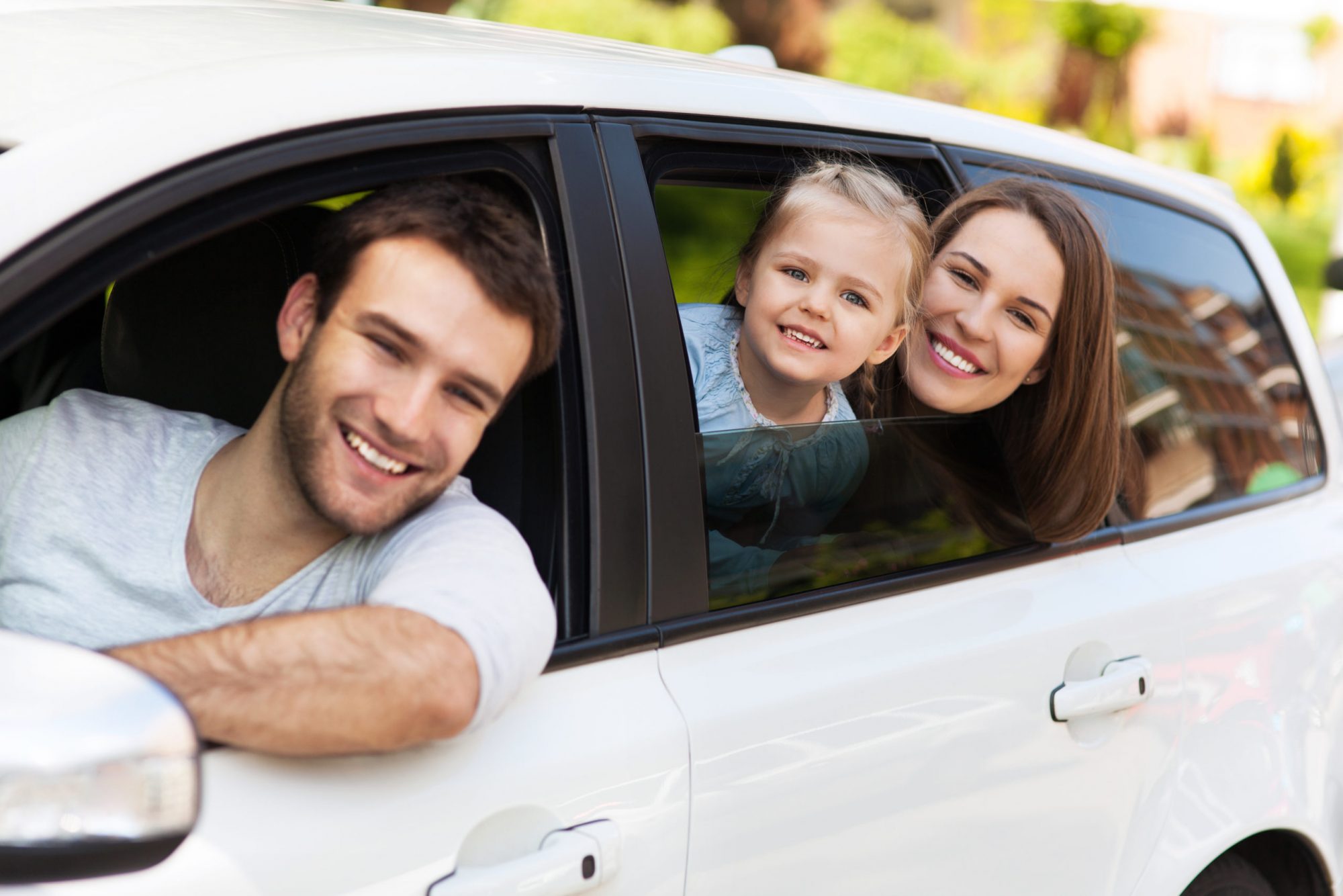 Blog - Family sitting in the car looking out windows